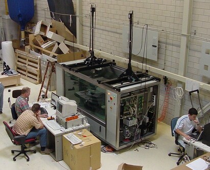 Ultrasonic/Eddy-current inspection system for GE90 engine parts.